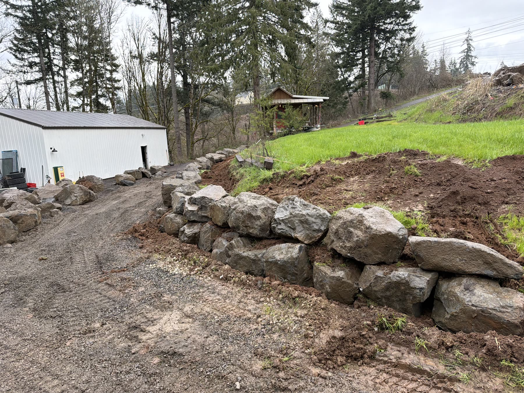 Boulder retaining wall built by Beaver Excavation